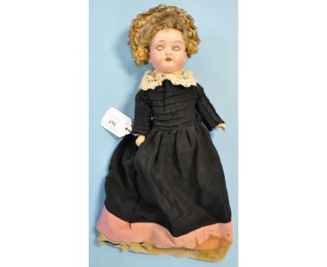A Simon Halbig bisque head doll, with sleeping brown eyes and open mouth exposing four teeth, incised PB within a star/SH/190