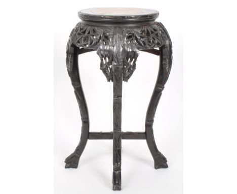 An early 20th Century Chinese carved hardwood jardiniere vase bust display stand. Inset circular marble top with fret pierced