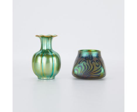 Zsolnay, Hungary. Group of two porcelain vases with iridescent green eosin glaze. One lobed vase with a scalloped rim, and on