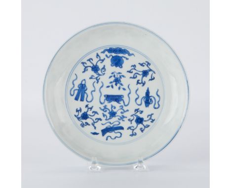 Chinese Kangxi blue and white porcelain dish, decorated with auspicious Buddhist symbols. Marked along the underside with an 