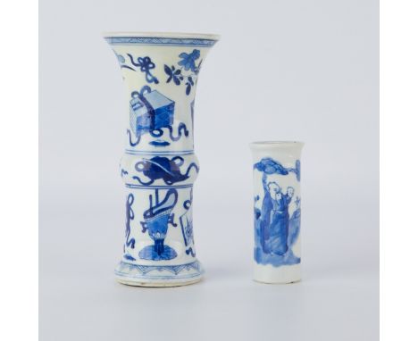 Group of two Chinese Kangxi period blue and white porcelain vases. One gu vase or beaker vase, decorated throughout with ausp