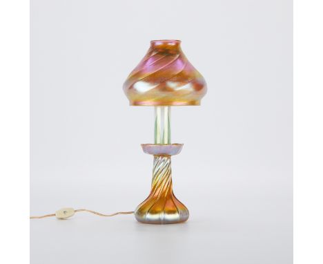 Tiffany Studios, United States. Favrile iridescent or iridized art glass lamp with an elegantly twisting pattern along the ba