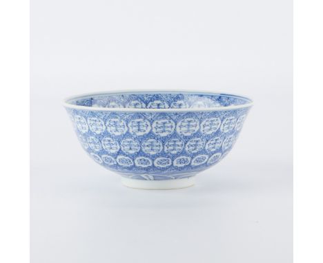 Chinese blue and white porcelain bowl, with meticulous geometric decoration radiating from the center. With a six character Q