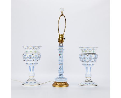 Group of three Bohemian cut overlay white to light blue glass objects including one lamp and a pair of lustres. All hand pain