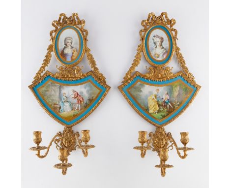 Pair of French Sevres style wall sconces with painted porcelain plaques. Each oval plaque depicts a portrait of a woman while