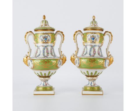 Pair of French old Paris Sevres style porcelain lidded urns decorated throughout with hand painted floral wreaths and gilt ac
