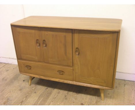 An Ercol medium elm sideboard, enclosed by three cupboards and single drawer, design no. 427, 3ft. 9in. - clean