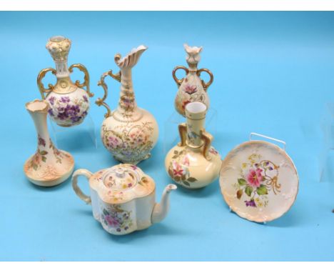 A Carltonware teapot, quatreform, printed and enamelled with flowers against an ivory ground and six other ivory-ground vesse