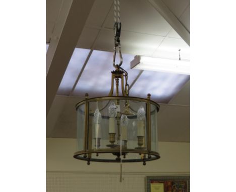 A pair of large brass porch light fittings, cylindrical shape with four electric sconces, with ceiling rose, 15in. diameter a