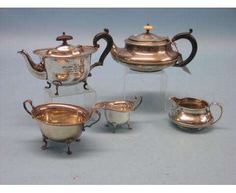 A silver teapot, circular depressed shape, Birmingham 1922, approx. 16oz. gross and four items of plated teaware