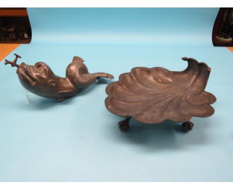 A 19th century French pewter levabo, dolphin tap with spigot, shell-shape basin, basin 15.5in.