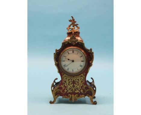 A French boullework mantel clock, rococo-shape with convex enamelled dial, brass mounts, French timepiece movement, with key,