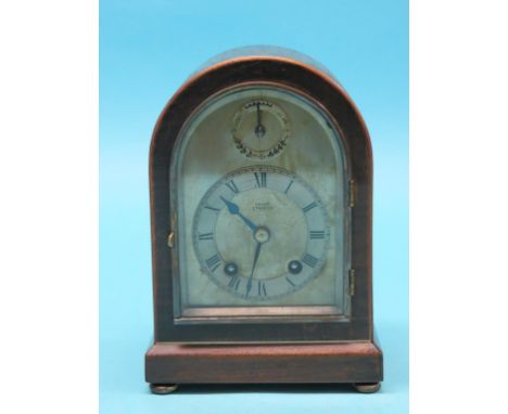 An early 20th century mahogany mantel clock, domed, silvered dial signed Usher, Lincoln, Astral movement striking on a gong, 