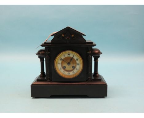 A Victorian black slate mantel clock, architectural form with enamelled dial, French movement, gong-striking, with key and pe