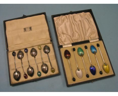 A set of six Liberty's silver coffee spoons, with gemstone settings, Birmingham 1924 and a set of six silver and enamel coffe