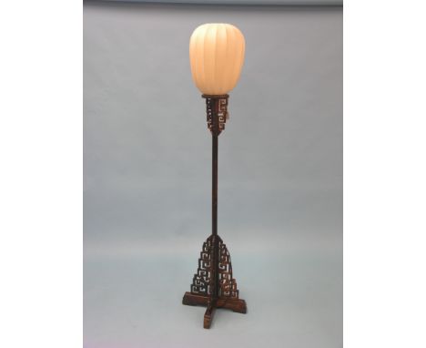 A Chinese hardwood floor lamp, with fret-carved detail, with shade