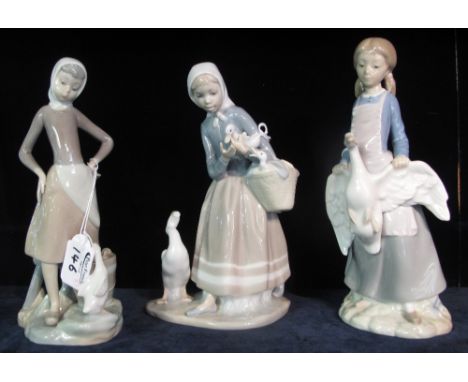 Two Lladro Spanish porcelain figurines together with a Nao Spanish porcelain figurine of a girl with a goose. (3)(B.P. 24% in