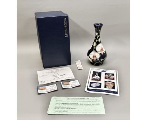 A Moorcroft limited edition Chatsworth Vase - bottle form, decorated in the Chatsworth Orchid design by Phillip Gibson, impre