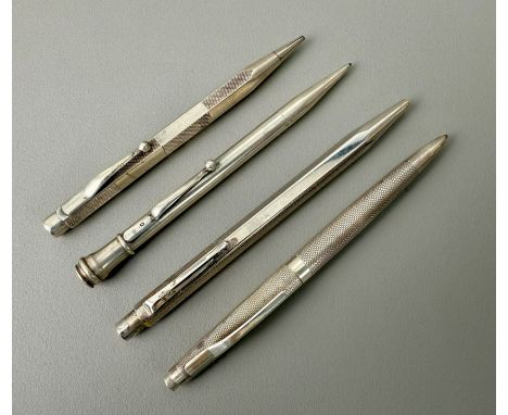 Two silver propelling pencils, a silver ballpoint pen and a 'Caran d'Ache' ballpoint pen - 1. two mid-20th century silver pro