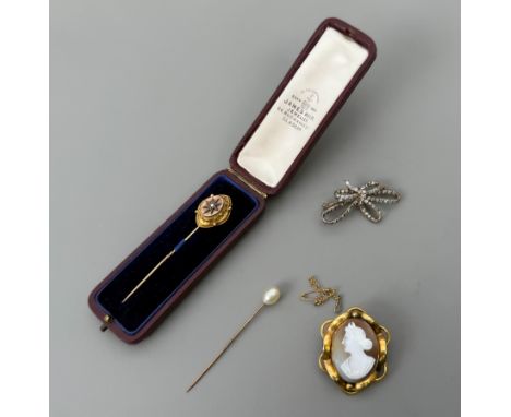 A small group of antique jewellery - comprising an Edwardian&nbsp;9ct gold, silver and diamond tied-ribbon pendant brooch, se