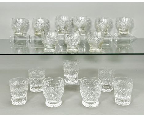 A set of nine cut glass whisky tumblers - 1960s-70s, the ovoid bowls with diamond and X cut decoration, on star cut bases, 9.