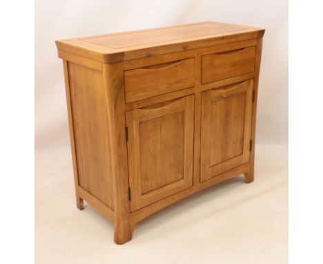 A modern light oak side cabinet - the cleated, panelled top over two drawers and a two-door cupboard below, all with top-edge