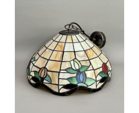 A Tiffany style stained glass hanging ceiling lamp - late 20th century, in marbled cream and ochre glass with stylised flower