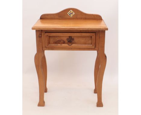 A waxed pine side or hall table by Kubek Pine - the arched quarter-gallery with inset floral ceramic tile, above a single pan