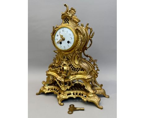A brass mantel clock in&nbsp;late 19th century French rococo style - the 8-day, 2-train movement with outside countwheel stri