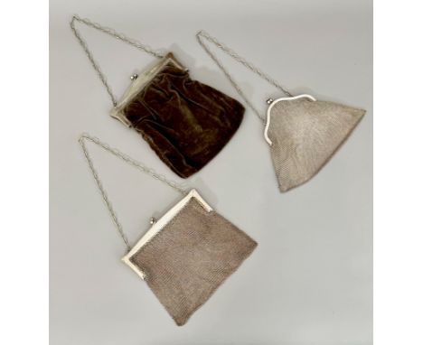 Two white metal chain mail evening bags, first half 20th century - with engine turned decoration to the frames and cable link