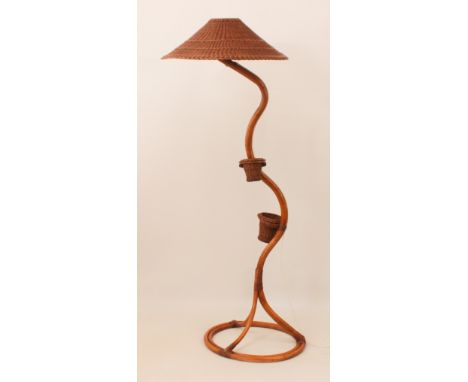An Angraves bamboo standard lamp and shade - the serpentine column mounted with two wicker planters, on an openwork circular 