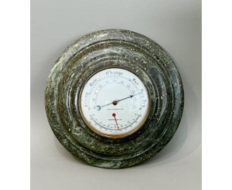 A Cornish serpentine barometer / thermometer - mid-20th century, the 4&frac12;in silvered dial within a turned serpentine cas