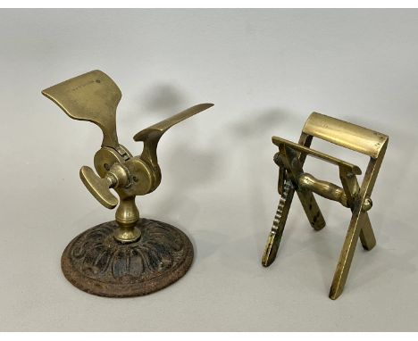 Two Victorian brass apothecary / pharmacist's paper powder folders - one on a black painted cast iron flower head base, the a