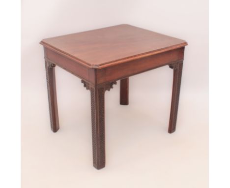 A mahogany drinks table in the Chippendale taste - first half 20th century, the rectangular top with clipped corners, raised 