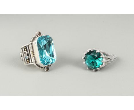 Two sterling silver rings - one with a large blue glass stone, within a rope twist and bead border set with two round cut smo