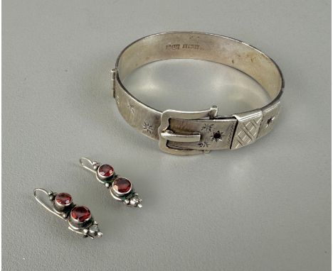A Victorian style silver and garnet bangle - Bracelon Ltd, Birmingham 1962, of belt design with hinged buckle fastening, with