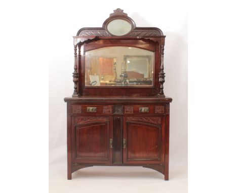 An Edwardian mahogany mirror-backed parlour cabinet - the shaped back with a high oval mirror over a shelf on tured supports,