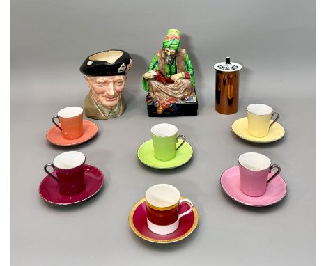 A small group of porcelain and bone china - comprising a Royal Doulton HN1706 'The Cobbler' figure, dark green printed and bl