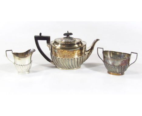 A Victorian silver three piece bachelor's tea service, comprising teapot with ebonised angular thumb mould handle and compres