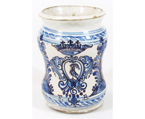 A tin glazed earthenware Albarello dry drug jar, of hand thrown inverted circular outline, in blue and white decorated with a