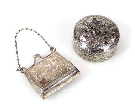 An import silver patch box, of circular outline chased with scrolls and a repeat floral banding with thumb mould handle and p