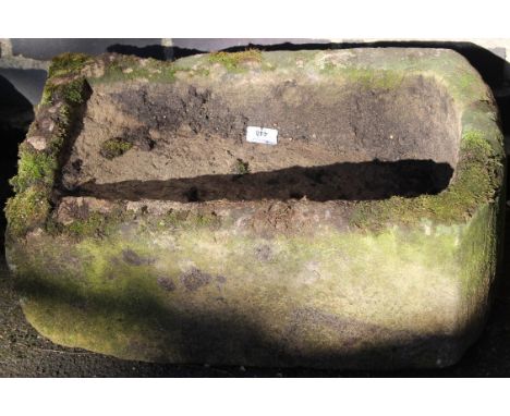 A D-end sloping stone trough, (the outline) 27cm high, 53cm wide, 36cm deep.