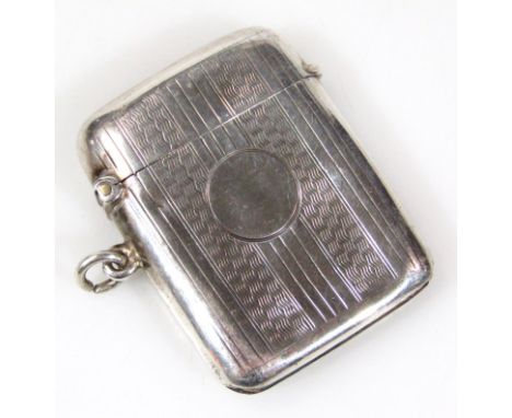 A George V silver vesta case, of oblong outline with plain cartouche and part engine turned body, with ring side and plain gi