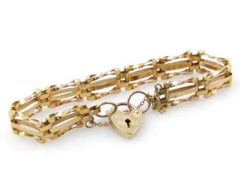 A gate bracelet, with three row bar design and padlock, gold plated. 