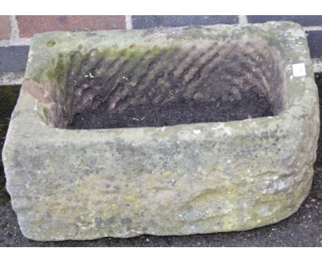 A D-end stone trough, 24cm high, 59cm wide, 46cm deep.
