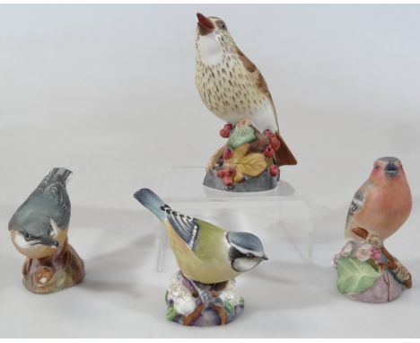 Various Royal Worcester bird ornaments, comprising thrush 3234, 12cm high, chaffinch 3240, blue tit 3199 and nut hatch 3334, 