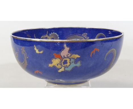 An early 20thC Carltonware dragon lustre fruit bowl, of circular outline, decorated with dragons with gilt highlights on a ci