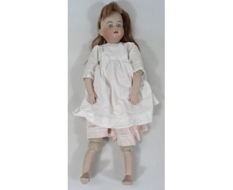 An early 20thC bisque headed Melba doll, with open fixed eyes, open mouth showing teeth, with articulated limbs in flowing dr