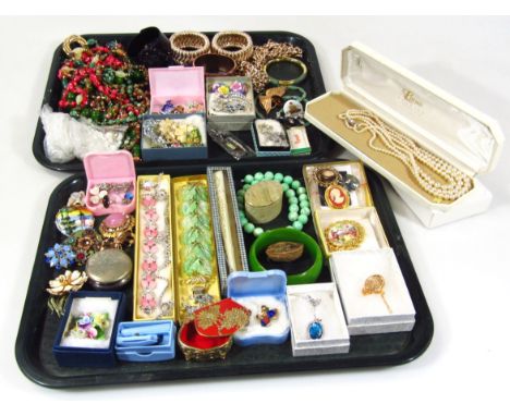 Various costume and other jewellery, jet style bangle, 5cm high, lotus style pearls, necklaces, brooches, casket, dress rings