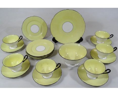 A mid 20thC Shelley china part tea service, in yellow, black and white colourway, comprising slop bowl, 15cm wide, serving pl